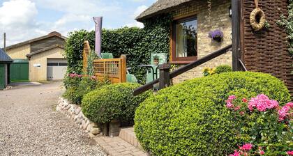 Ferienwohnung Am Eiderdeich" mit privater Terrasse, Gemeinschaftsgarten und Wi-Fi