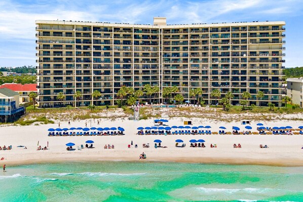 Toes in the sand, eyes on the Gulf — The Commodore's front-row seat to it all.