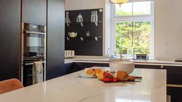 Fridge, oven, dishwasher, dining tables
