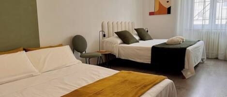 1 bedroom, desk, iron/ironing board, travel crib