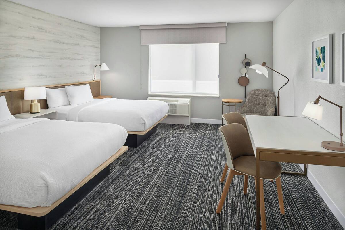 Hypo-allergenic bedding, desk, laptop workspace, blackout curtains