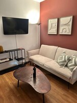 Standard Room | Living area | 30-inch plasma TV with digital channels