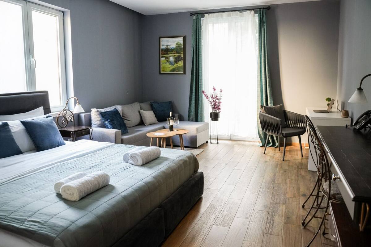 Basic Quadruple Room | 1 bedroom, desk, laptop workspace, iron/ironing board