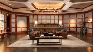 A spacious lobby with a central seating area, a reception desk, and a modern chandelier. - RITZ CARLTON RESIDENCE - Vaill Colorado,  3 bedroom, lovely mountain views . (Vail)