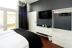 Quarto casal | Área de estar | TV