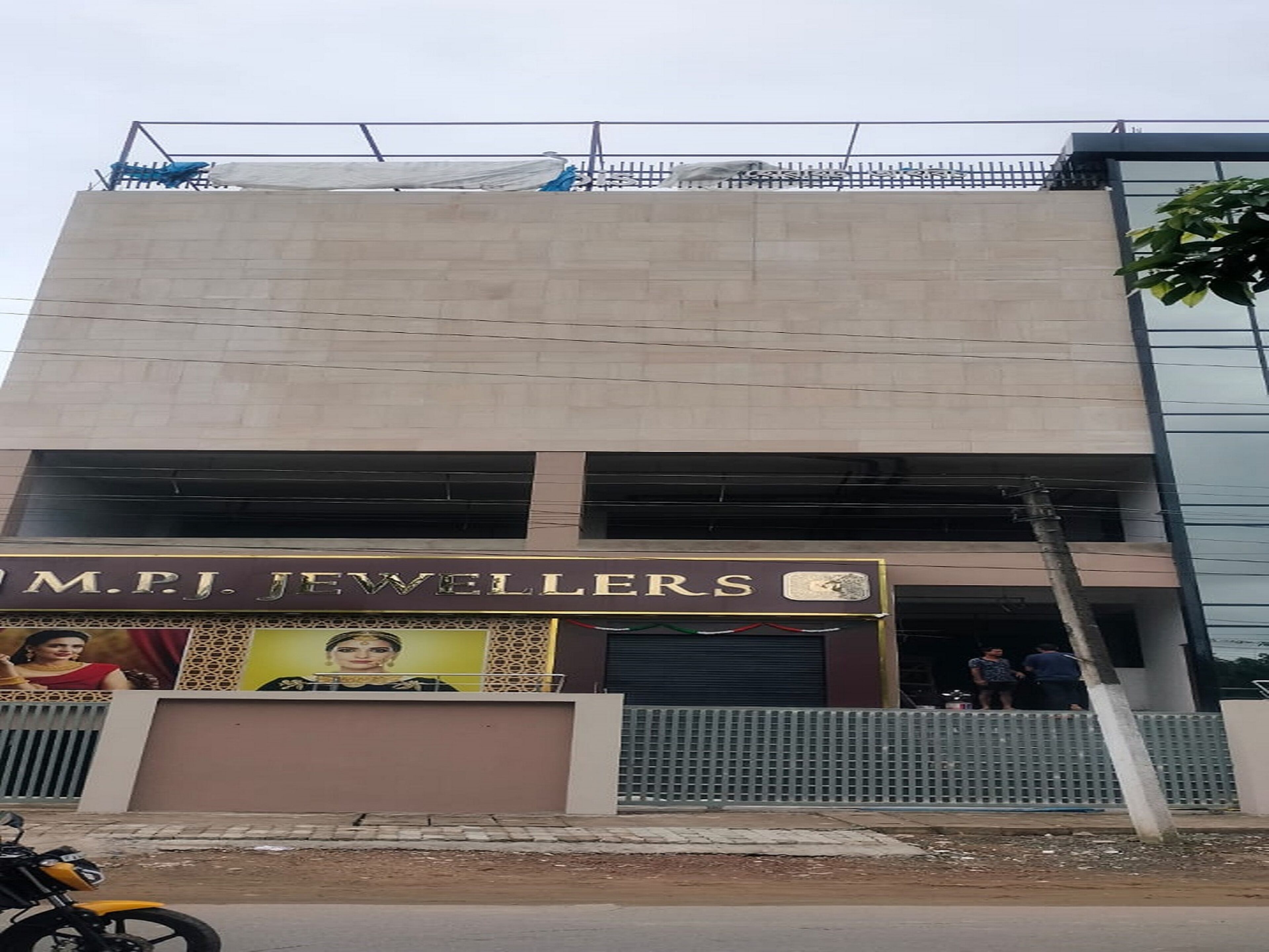 A building with a sign for 'M.P.J. Jewellers'.