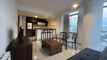 Comfort Apartment, Mountain View | Living area | 40-inch LED TV with digital channels