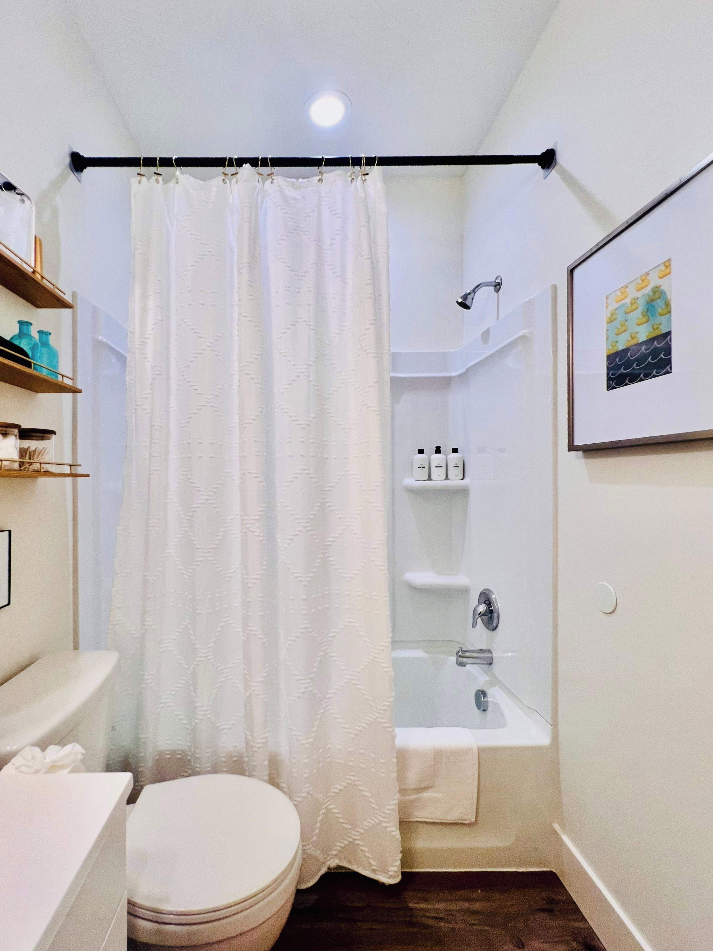 Shower, hair dryer, towels, shampoo