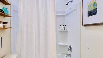 Shower, hair dryer, towels, shampoo