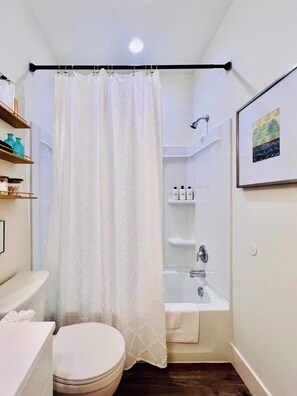 Shower, hair dryer, towels, shampoo