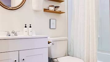 Shower, hair dryer, towels, shampoo