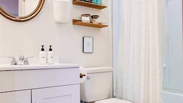 Shower, hair dryer, towels, shampoo