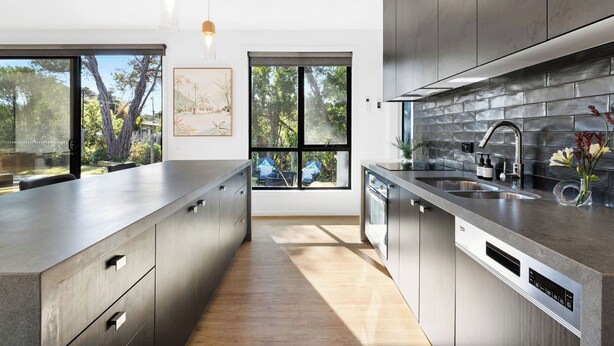 A modern kitchen with a large island, stainless steel appliances, and a view of the outdoors. - Sublime Sanctuary: 4  BR, 2  BA House in Rye , Sleeps 14 (Rye)