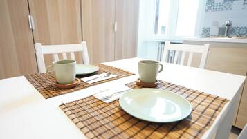 Mini-fridge, oven, stovetop, cookware/dishes/utensils