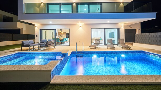 A modern two-story house with a swimming pool and outdoor seating area. - Villa Adria Dream by Litto (Kastela)