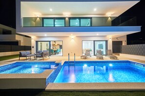 A modern two-story house with a swimming pool and outdoor seating area. - Villa Adria Dream by Litto (Kastela)