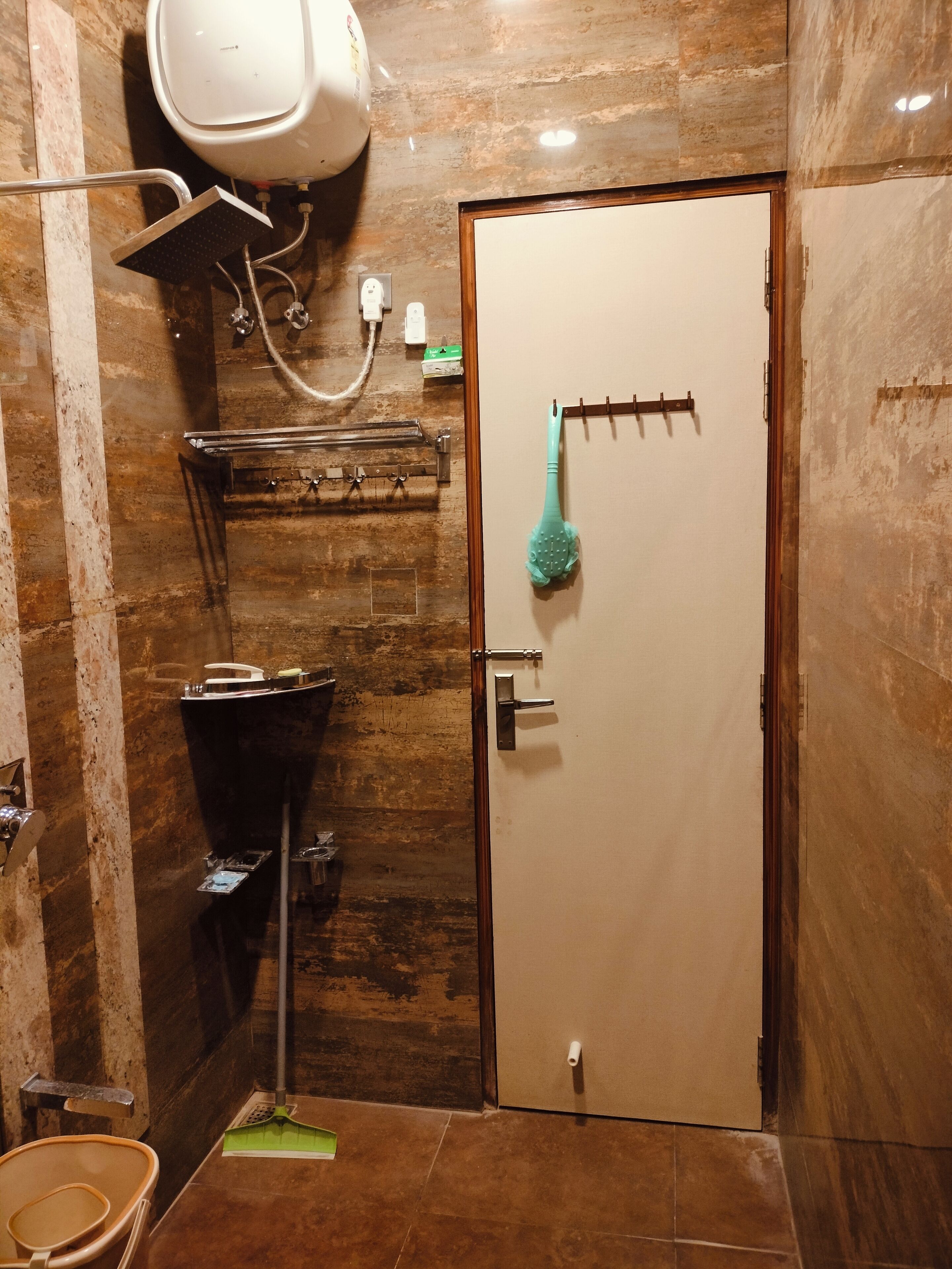 A bathroom with a shower, toilet, and sink.