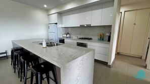 Fridge, spices, dining tables - Caves Beach Retreat - close to beach and shops (Caves Beach)
