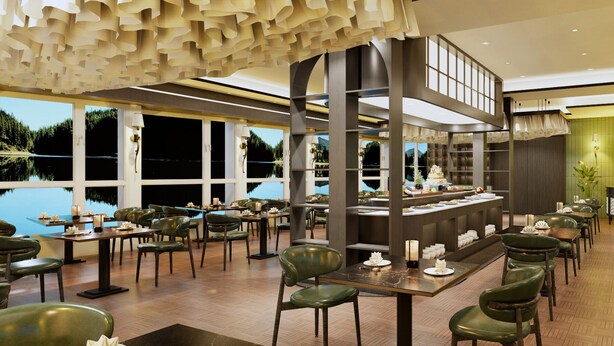 Un restaurante con barra central, varias mesas para comer y sillas.