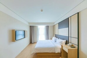 A modern hotel room with a bed, bedside table, and a large window with curtains. - JI Hotel (Zhengzhou Xinzheng International Airport) (Xinzheng)