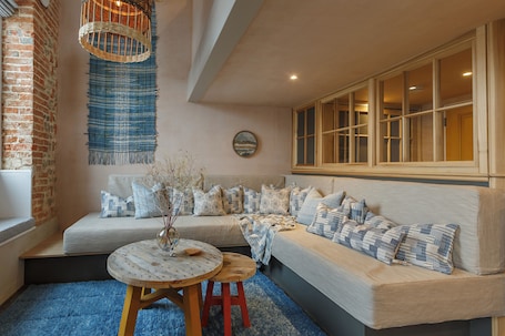 Luxury Apartment | Living area | 50-inch Smart TV with satellite channels