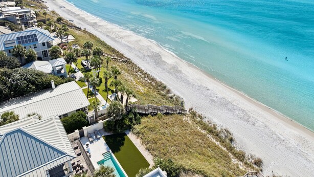 A coastal property with a swimming pool, beach access, and a view of the ocean. - Dreamy retreat—5-min to beach, private pool, LSV, & home theater | Sleeps 20! (Seagrove Beach)