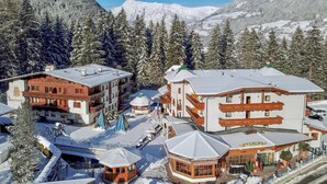 A snow-covered mountain resort with multiple buildings, including a ski lodge and a restaurant. - Holiday apartment with wellness area (Ötz im Ötztal)