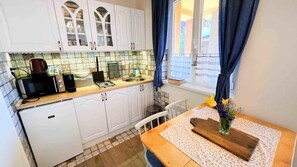 Fridge, microwave, stovetop, coffee/tea maker