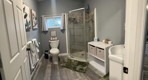 Shower, hair dryer, towels, soap
