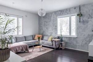 Deluxe Apartment, Courtyard View | Living area | 55-inch Smart TV with cable channels