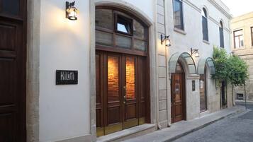 A building with a sign reading 'Kilim.'
