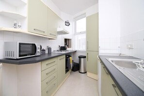 Fridge, microwave, toaster, dining tables