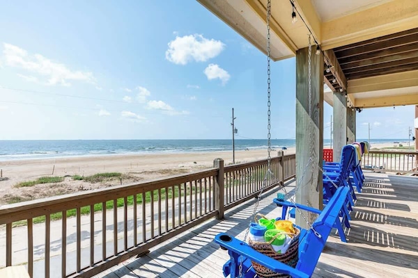 Large wraparound deck with chairs and swing to enjoy the ocean view