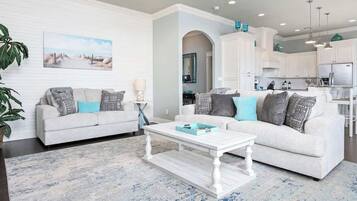 TV connectée, cheminée, livres, espaces bureaux