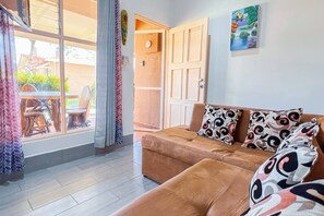 Standard Villa, 2 Bedrooms, Kitchen, Garden View | Living area | Flat-screen TV