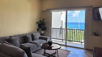 Apartment, Patio, Sea View | Living area | 40-inch flat-screen TV with digital channels