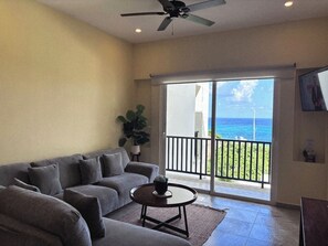 Apartment, Patio, Sea View | Living area | 40-inch flat-screen TV with digital channels