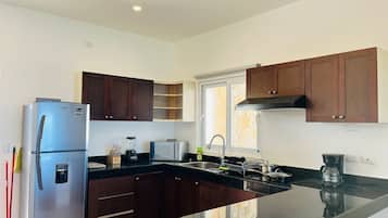 Apartment, Patio, Sea View | Private kitchen | Fridge, microwave, cookware/dishes/utensils