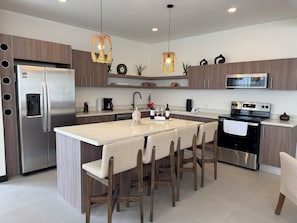 Fridge, microwave, oven, stovetop - Brand new luxury 3-bedroom 3-bathroom home features Pool, AC, WIFI, near beach (Playa Hermosa)