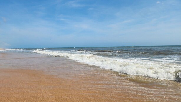 A beach with a sandy shore and waves. - Beach home 3br 2ba in Palm Coast (Palm Coast)