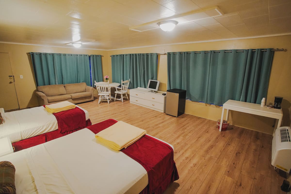 Luxury Studio Suite, Patio | Living area | 32-inch LED TV with digital channels
