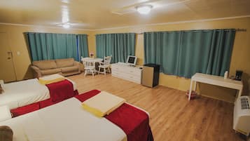 Luxury Studio Suite, Patio | Living area | 32-inch LED TV with digital channels