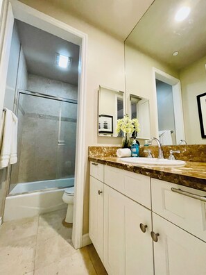 Hair dryer, towels, soap, shampoo