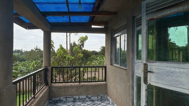 A balcony with a patterned floor, a metal railing, and a view of greenery. - 5 Bedroom Lodge Sleeps 10 - Pets Welcome (Kitanswa, Kebbega)