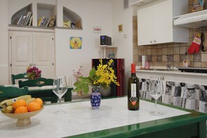 Fridge, stovetop, dishwasher, coffee/tea maker