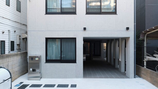 A modern building with two floors, large windows, and a covered entrance. - Fuente Nishi Sugamo by Tranova (Tokyo)