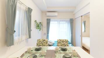 A (4-person Accomodation), Non Smoking (101) | Living area | Flat-screen TV