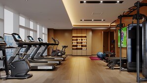 A modern gym with treadmills, elliptical machines, and weight equipment. - Fairfield by Marriott Chuzhou Railway Station (Chuzhou)