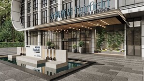 A modern hotel entrance with a curved facade, large windows, and a well-lit entrance area. - Fairfield by Marriott Chuzhou Railway Station (Chuzhou)
