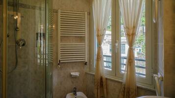 Shower, eco-friendly toiletries, bidet, towels